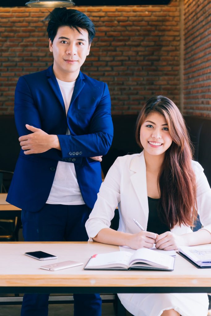 Asian young business man and woman in the office.