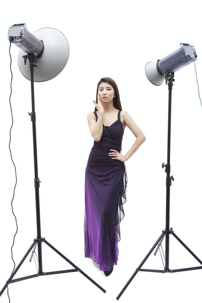 Fashion model posing in front of photoflash lamp